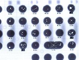 Figure 2. Typical results of an automated BGA evaluation (PBGA 352) after auto-set-up: three solder joints deviate from a true circle by more than 13%, one solder bridge is present and two solder joints have over 5% voids